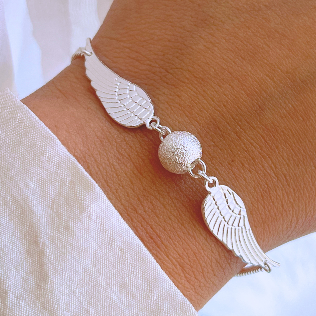 PULSERA ALAS Y ESFERA SATINADA