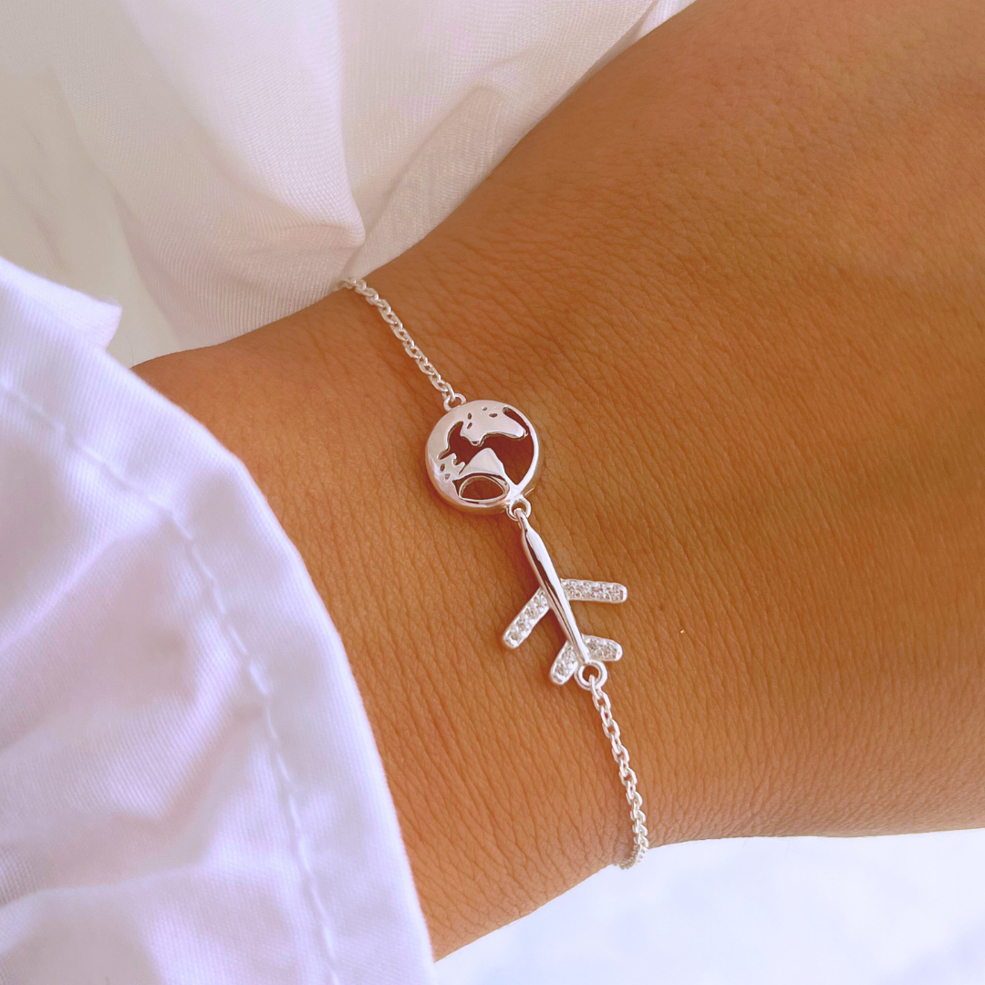 PULSERA AVIÓN CIRCONES Y MUNDO