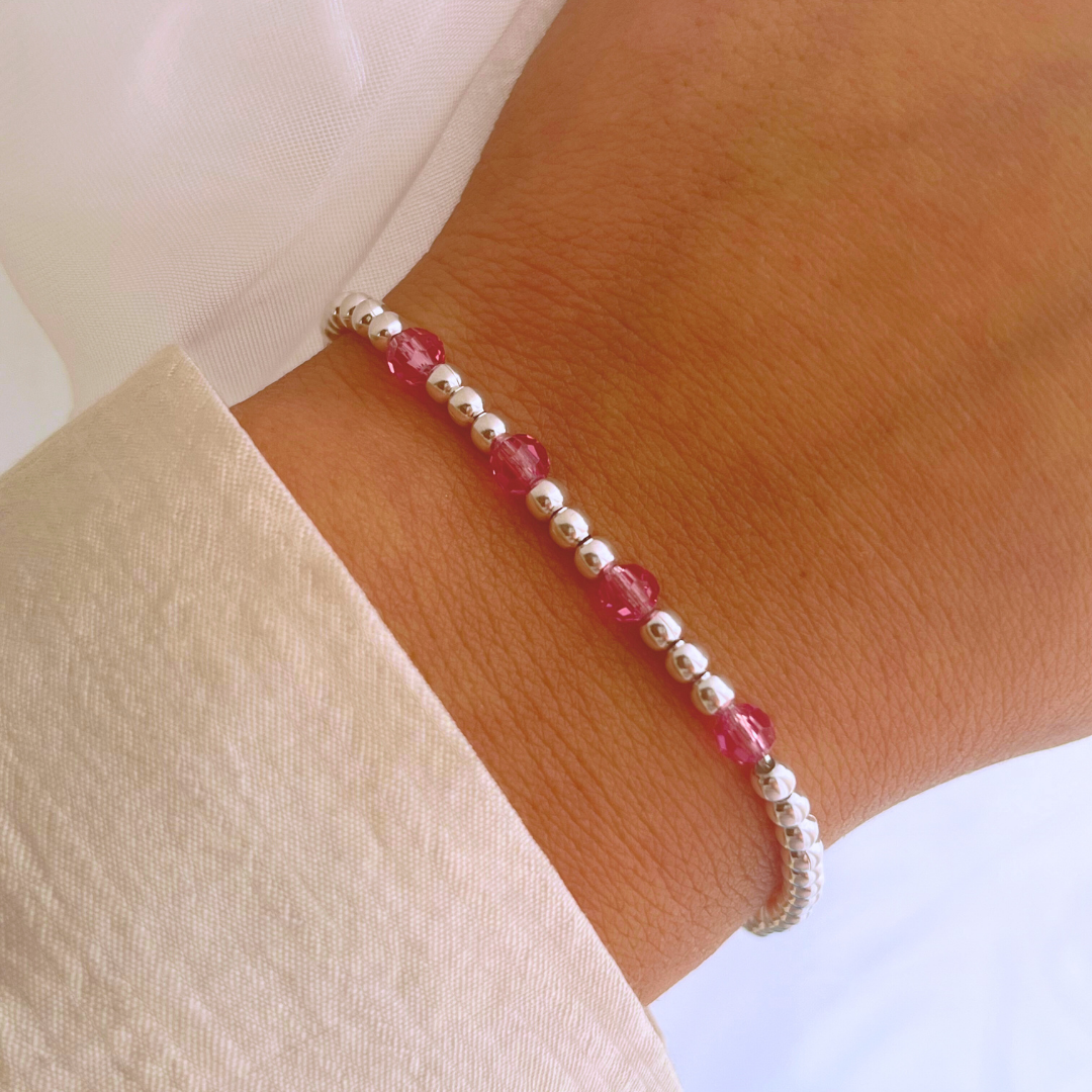 PULSERA AJUSTABLE ESFERAS Y CRISTALES ROSA
