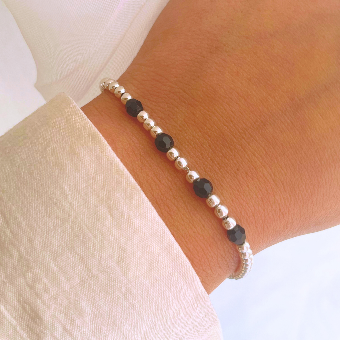 PULSERA AJUSTABLE ESFERAS Y CRISTALES ONIX
