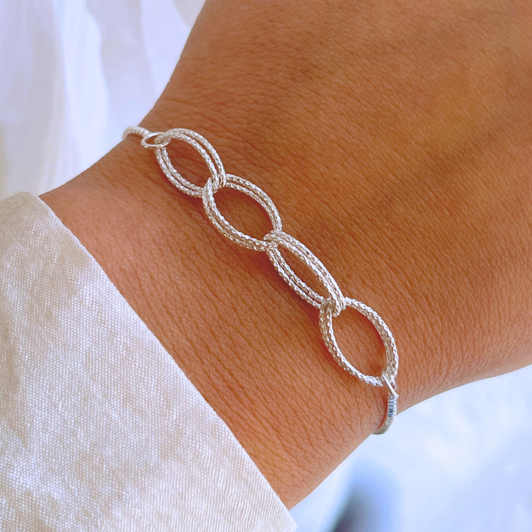 PULSERA AJUSTABLE ÓVALOS FACETADOS ENTRELAZADOS