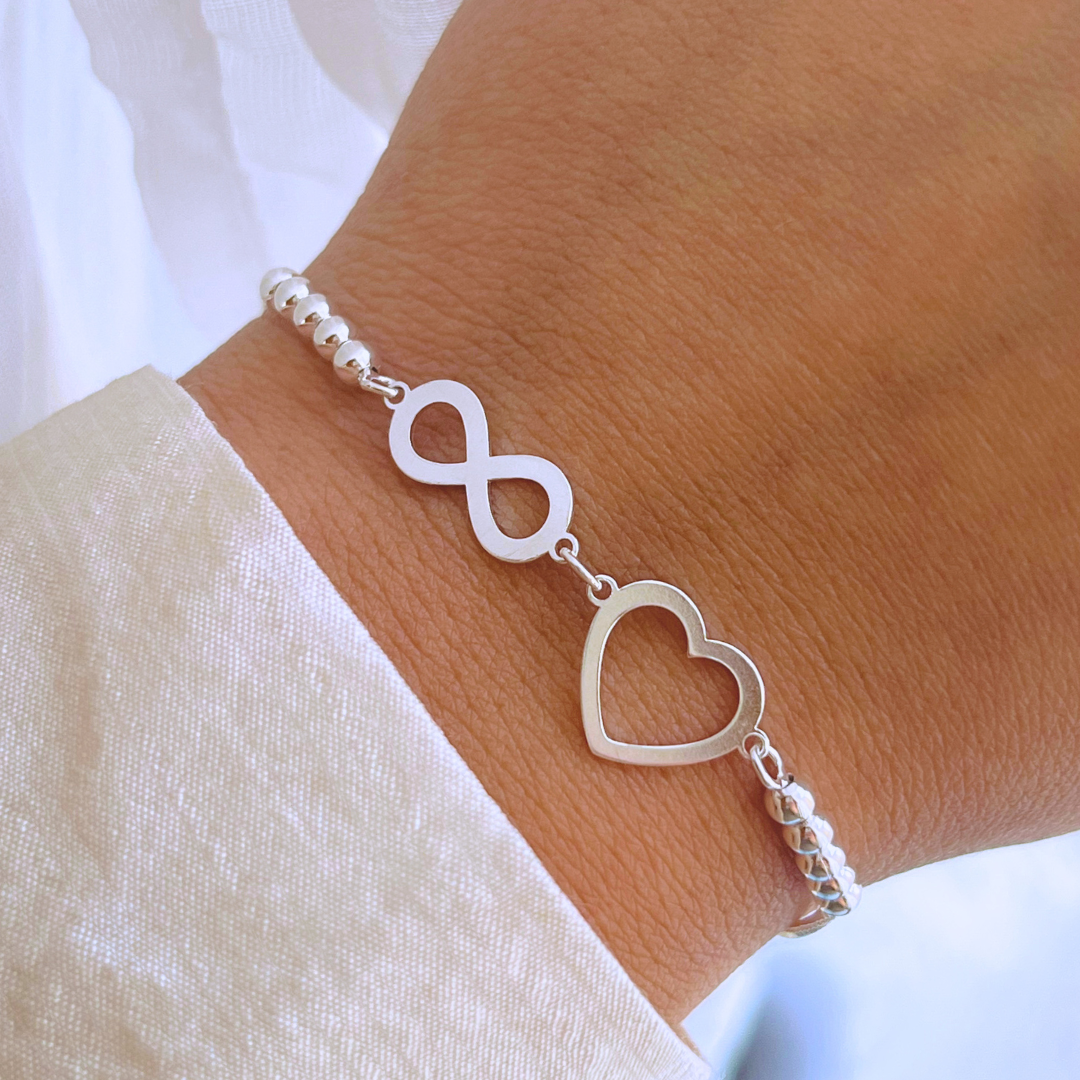 PULSERA AJUSTABLE CORAZÓN E INFINITO CON ESFERAS