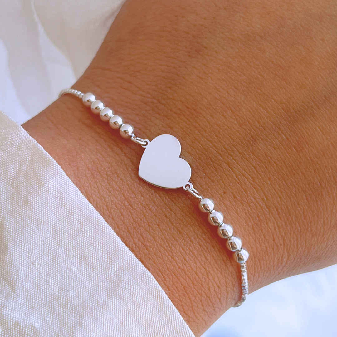 PULSERA AJUSTABLE ESFERAS Y CORAZÓN