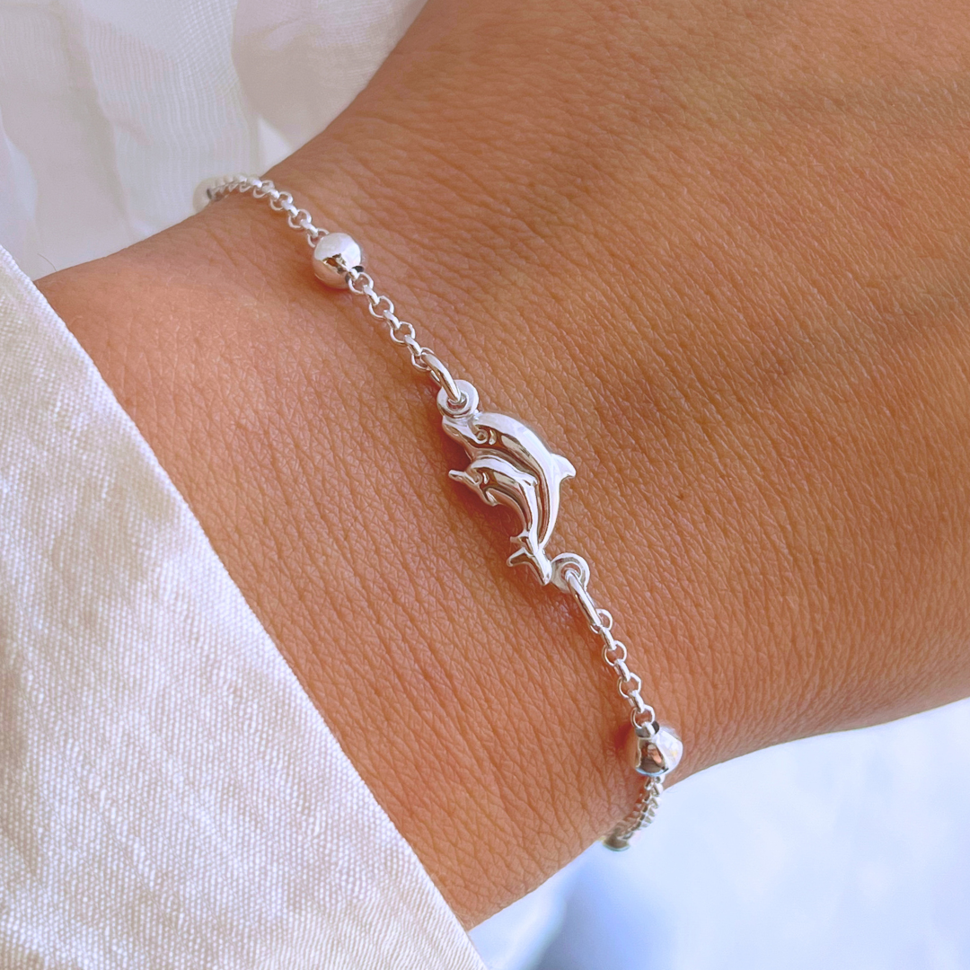 PULSERA DOBLE DELFIN Y ESFERAS