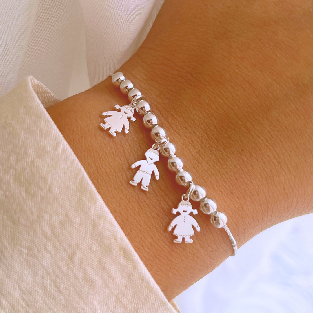 PULSERA ESFERAS DOS NIÑAS Y UN NIÑO