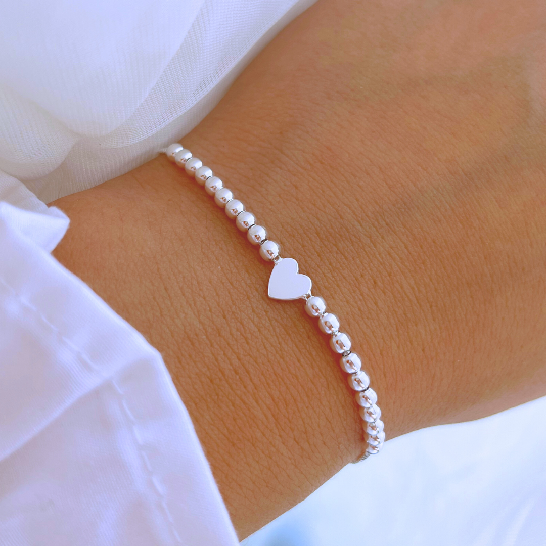 PULSERA AJUSTABLE ESFERAS Y CORAZÓN